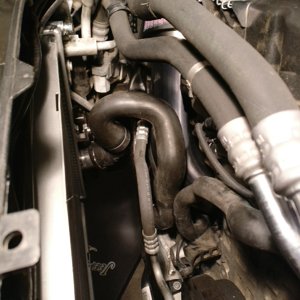 Head bypass and lower radiator hose